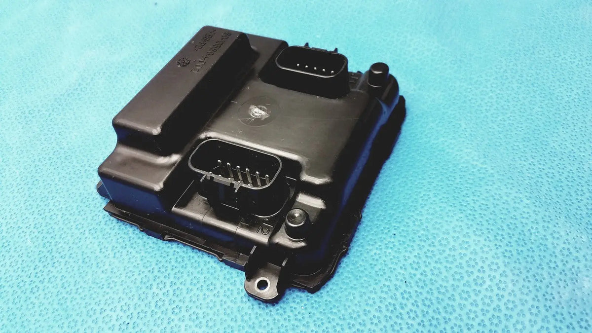 Black plastic engine control unit with two rectangular connectors and mounting holes for gem driver display reuse medical use