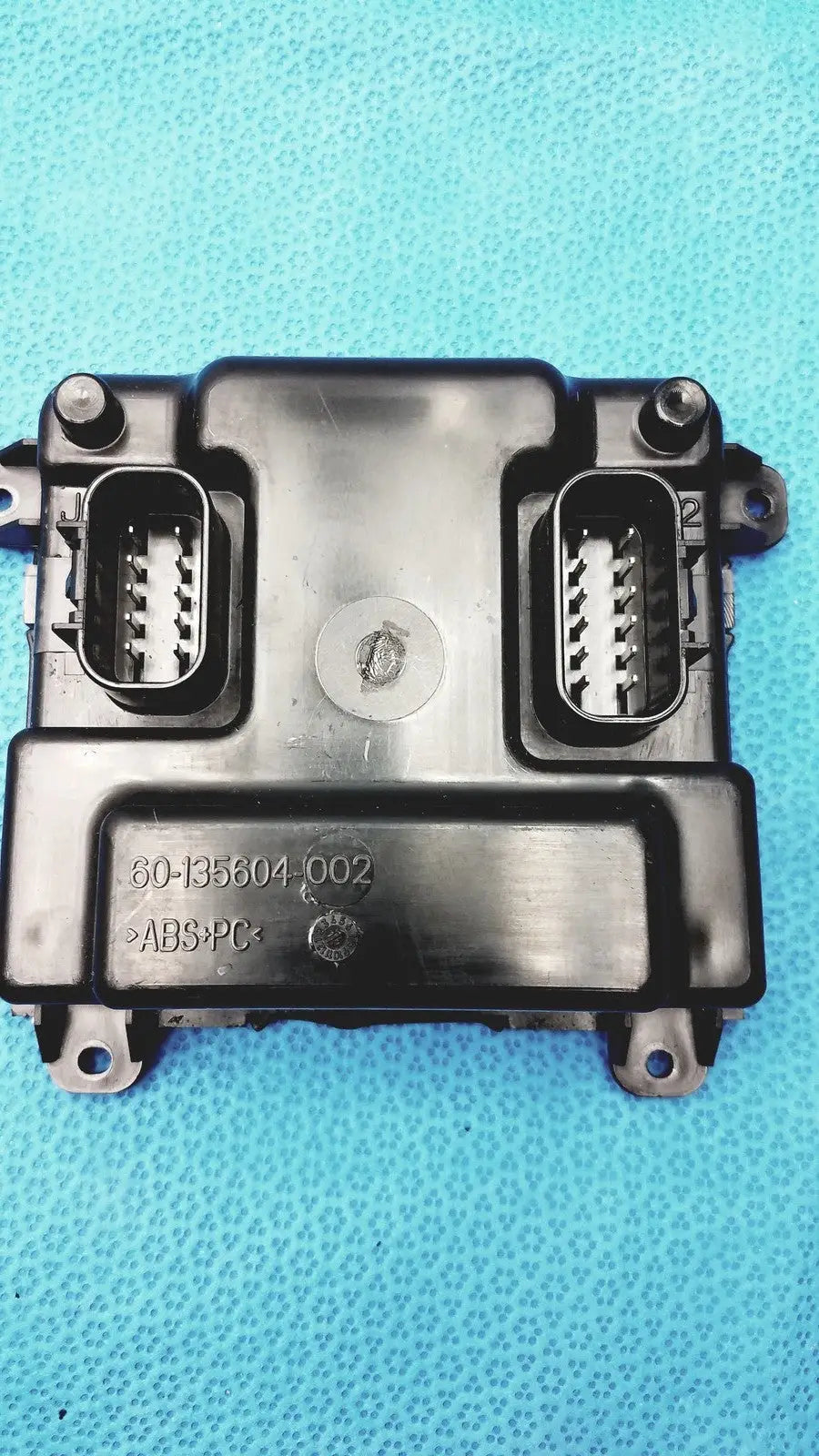 Black plastic engine control unit with two rectangular connectors and stamped part number for gem driver display reuse medical