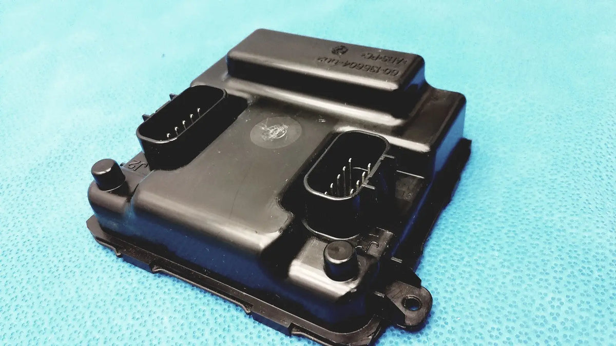 Black plastic engine control unit with two rectangular connector ports and stamped label for gem driver display reuse medical