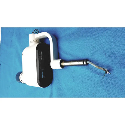 Gendex 770 tube head imaging equipment in white and black with curved handle, adjustable arm, and metallic tip for reuse medical use