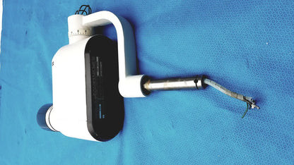 Gendex 770 tube head imaging equipment in white and black with curved handle, adjustable arm, and metallic tip for reuse medical use