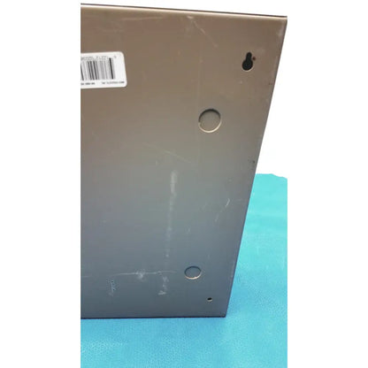 Dark gray general purpose medium steel nema 1 enclosure showing back panel with barcode label and three circular holes