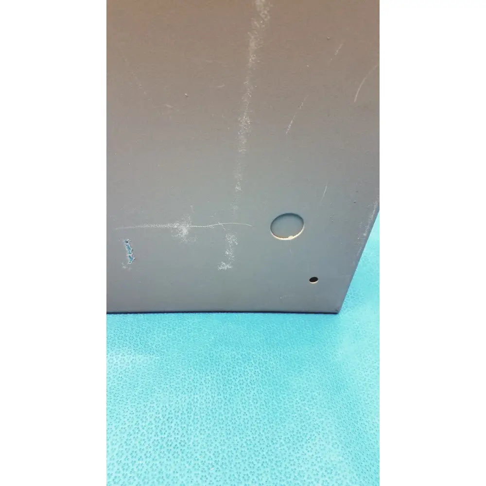Gray metallic general purpose medium steel nema 1 enclosure with circular hole and small corner indentation