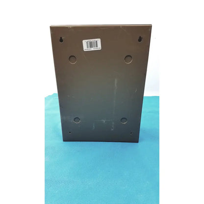 Dark gray metal plaque with four holes and screws on a general purpose medium steel nema 1 enclosure back side