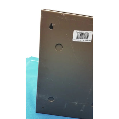 Matte black rectangular general purpose medium steel nema 1 enclosure back plate with three circular holes and barcode sticker