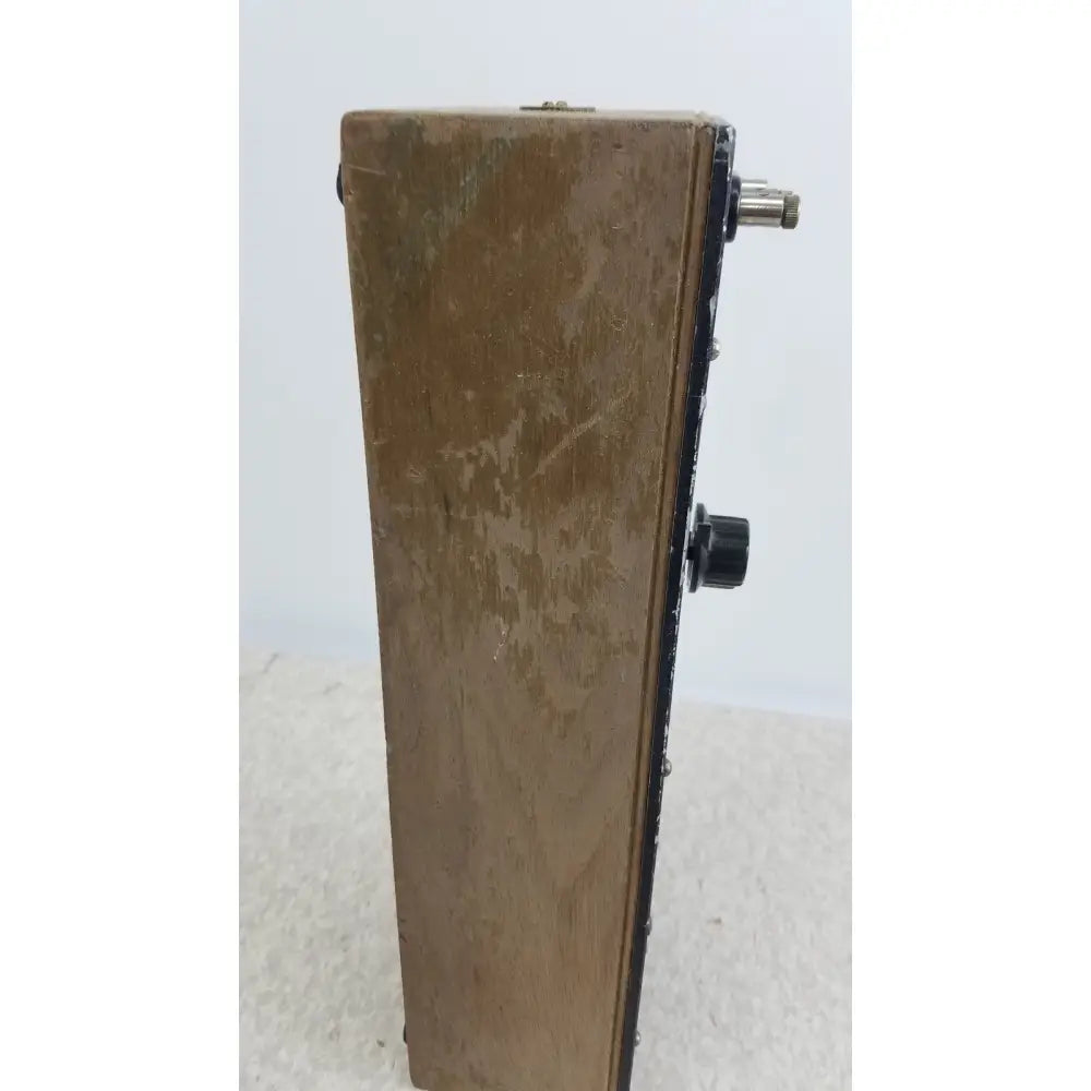 Worn wooden general radio 602-n decade resistance box with black knobs and metallic input jack for precise resistance settings