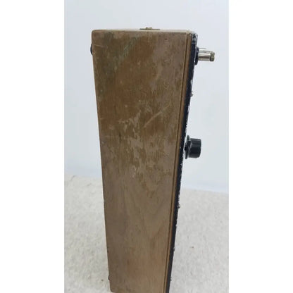 Worn wooden general radio 602-n decade resistance box with black knobs and metallic input jack for precise resistance settings