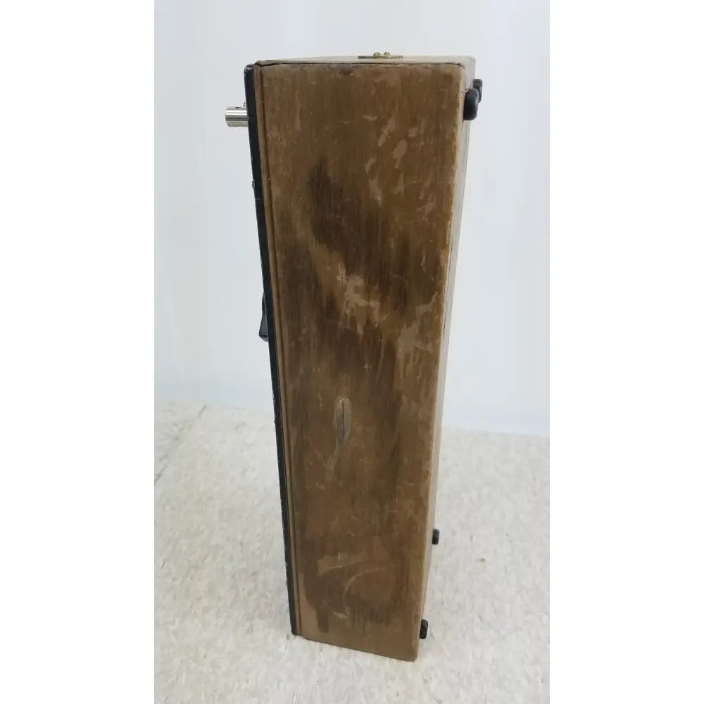 A weathered wooden decade resistance box with black metal corners and silver handle by general radio 602-n