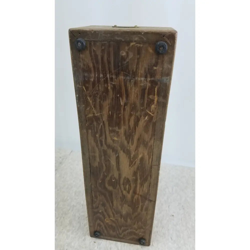 A weathered brown wooden decade resistance box by general radio 602-n with visible grain and black metal corner bolts