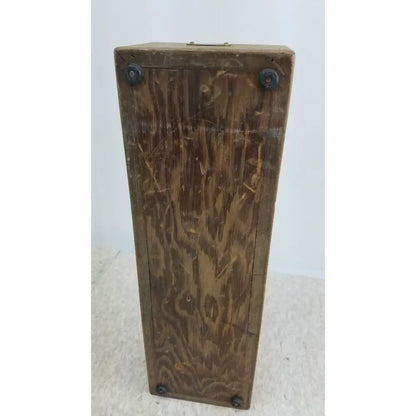 A weathered brown wooden decade resistance box by general radio 602-n with visible grain and black metal corner bolts