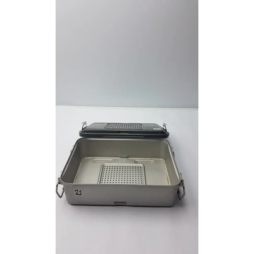 Genesis solid brass sterilization container with stainless steel surgical instrument tray black lid and perforated insert