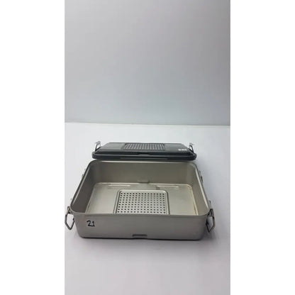 Genesis solid brass sterilization container with stainless steel surgical instrument tray black lid and perforated insert