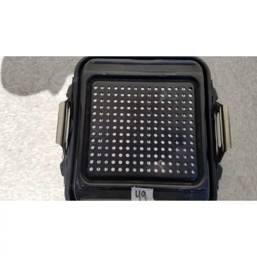 Black plastic genesis sterilization container half lid with perforated surface and metallic side handles