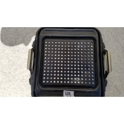Black plastic genesis sterilization container half lid with perforated surface and metallic side handles