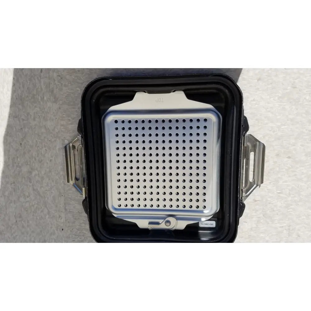 Silver perforated metal grilling rack with black plastic casing and metallic latches for genesis sterilization container half lid black