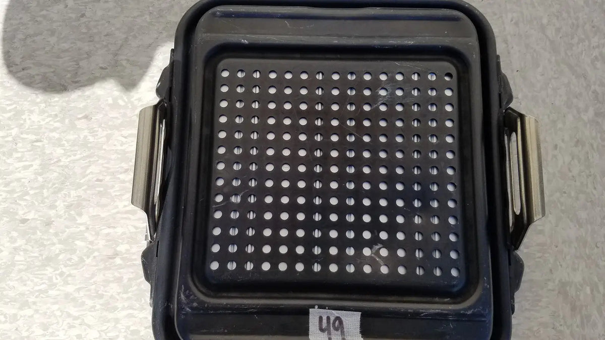 Black plastic genesis sterilization container half lid with perforated surface and metallic side handles