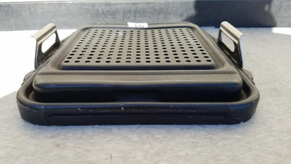 Black plastic genesis sterilization container half lid with perforated surface and metal handles for secure grip