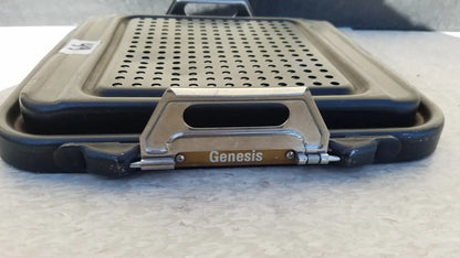 Black and silver Genesis sterilization container half lid with a perforated cooking surface for efficient sterilization