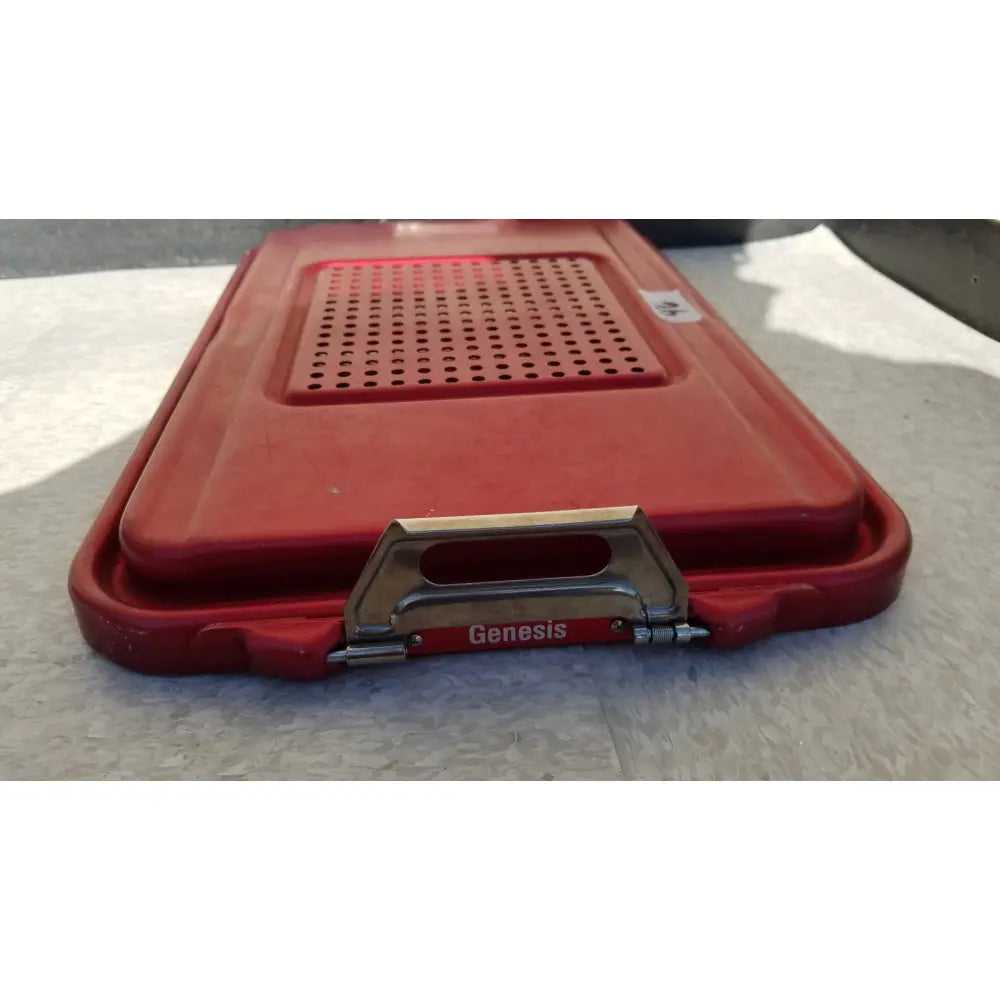 Red plastic genesis sterilization container half lid with perforated top and metal handle for medical use