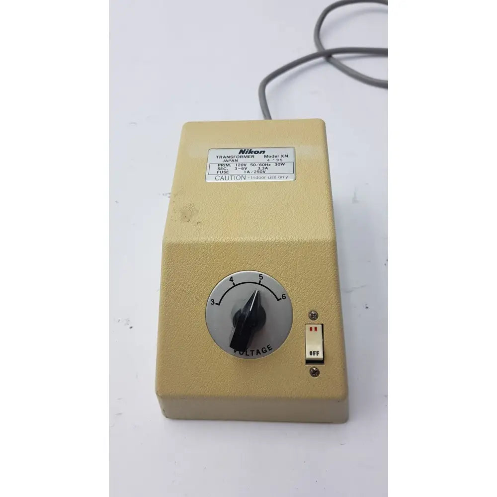 Beige genuine nikon transformer xn made in japan with voltage dial and toggle switch for precise power control