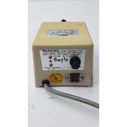 Beige genuine nikon transformer xn power supply unit with black rotary knob and warning label transformer xn made in Japan