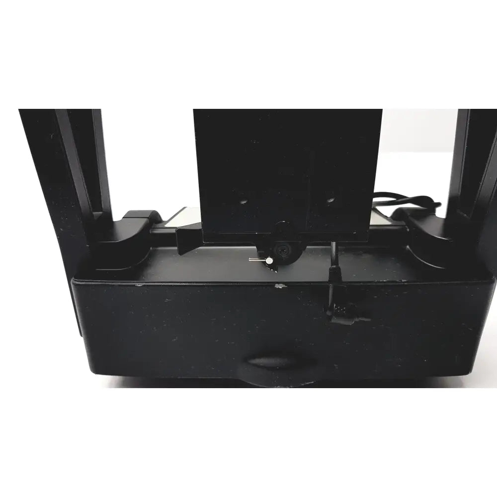 Black plastic 3d printer bed with small white component for gigapan epic pro robotic motorized panohead mount
