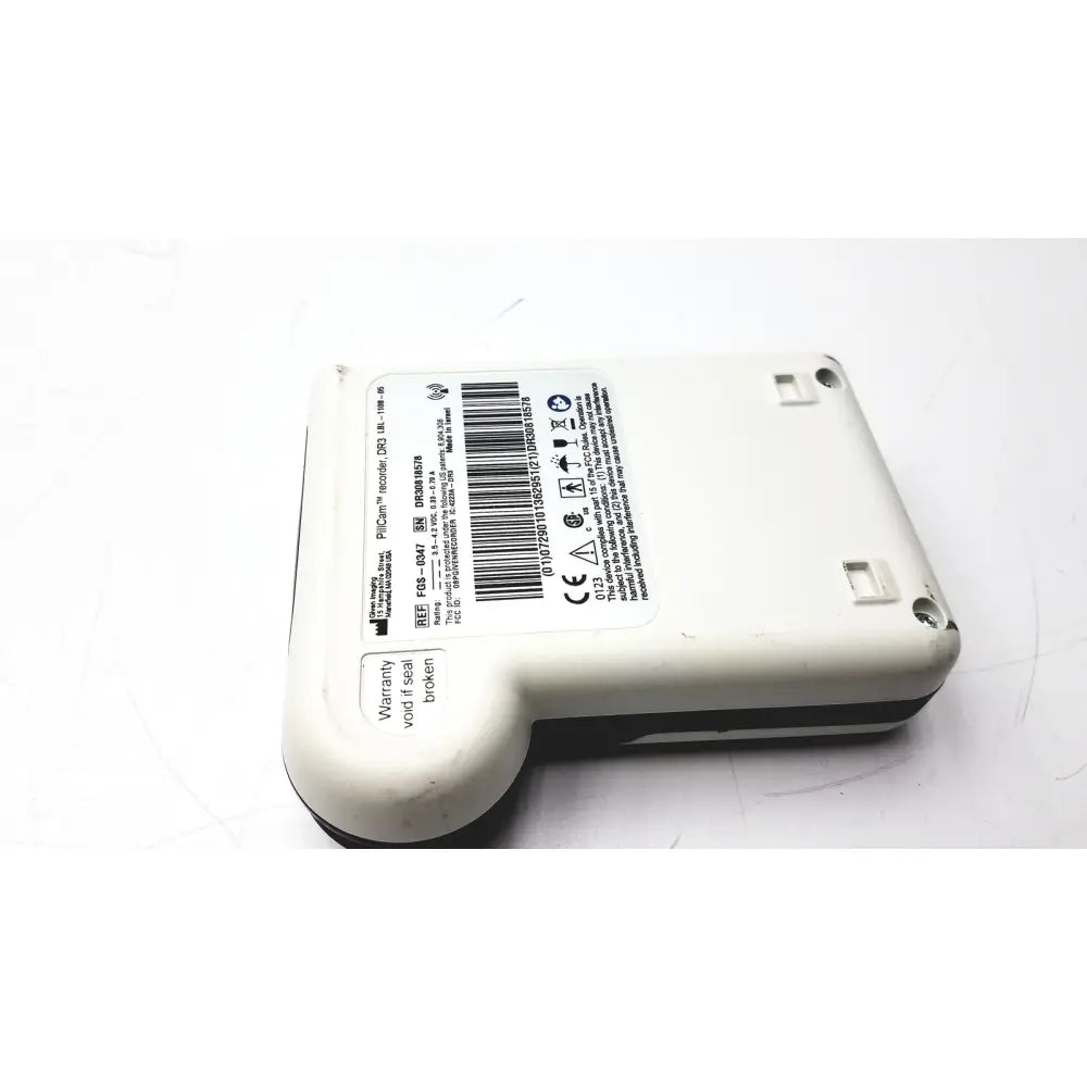 White plastic philips f85 pillcam recorder data dr3 with black trim and certification label on back side