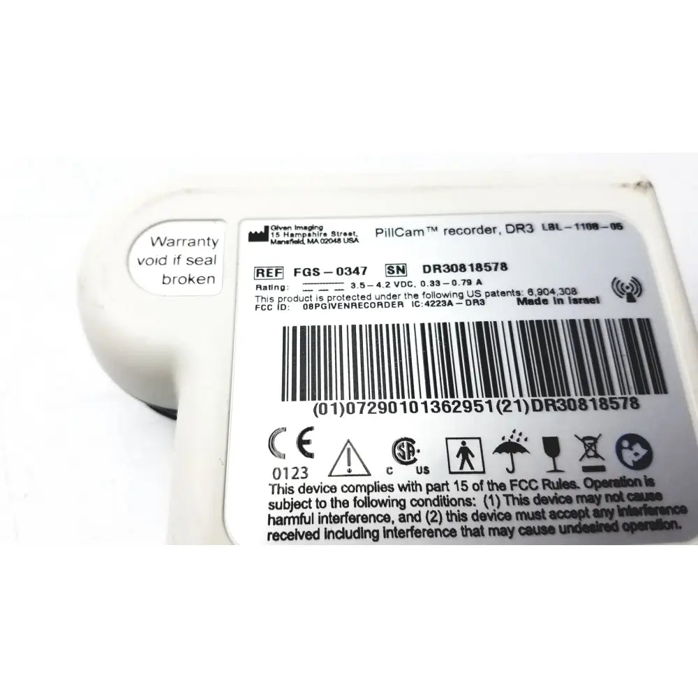 White plastic pillcam recorder data dr3 with rounded casing and printed regulatory labels from given imaging fgs-0347