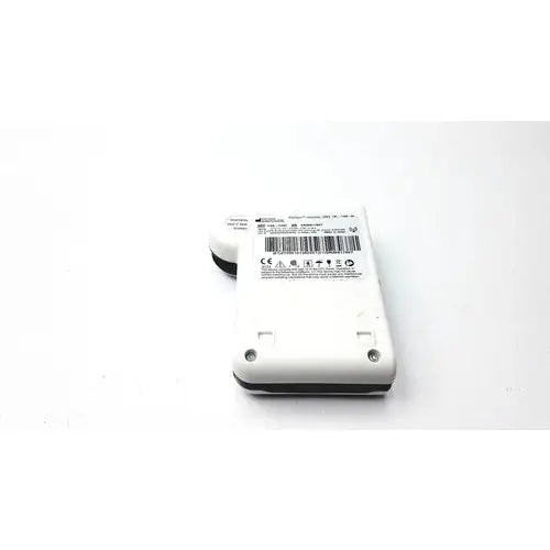 White plastic Given Imaging Inc fgs-0347 pillcam recorder with black rubberized edges and barcode label on the back side