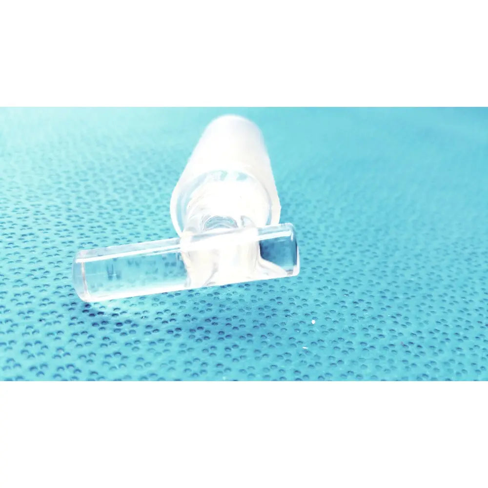 Clear plastic eye drop bottle with matching cap and dropper representing borosilicate laboratory valve hollow stopcock with 10mm bore