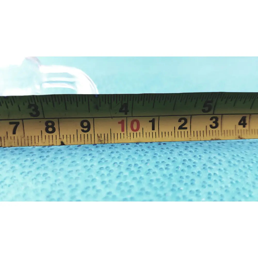 Yellow metal tape measure with black markings and red number 10 beside glass adapter for rubber tubing straight connection