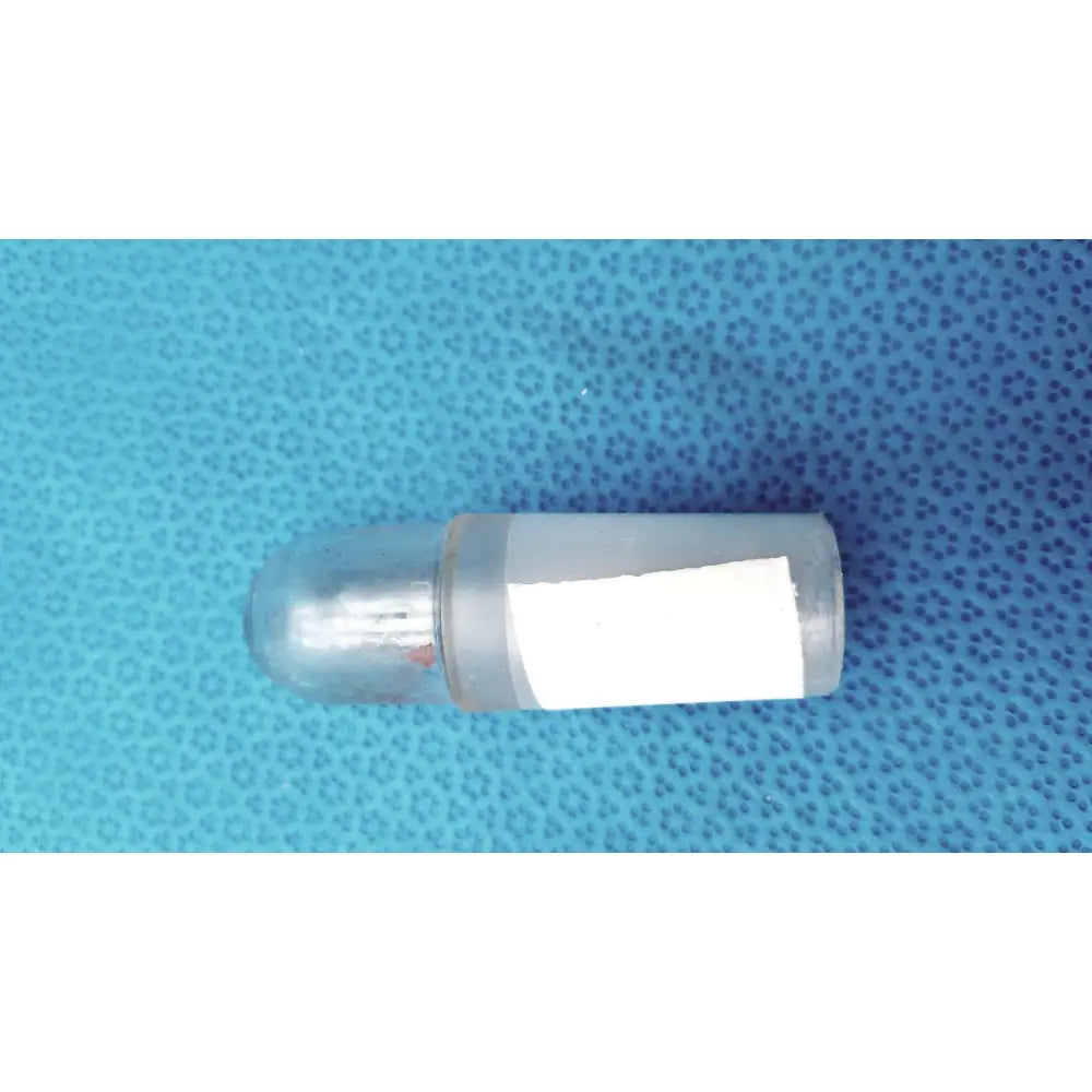 Clear plastic led light bulb with rounded dome top and white label as part of a glass flask stoppers ground glass lab set