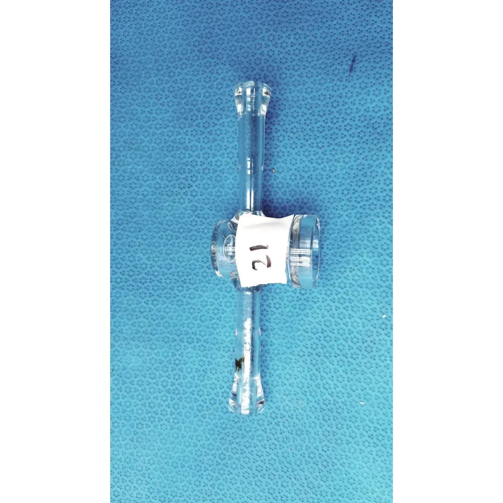 Clear glass lab adapter with 24/40 joint and white labeled stopcock valve made of borosilicate for chemistry use