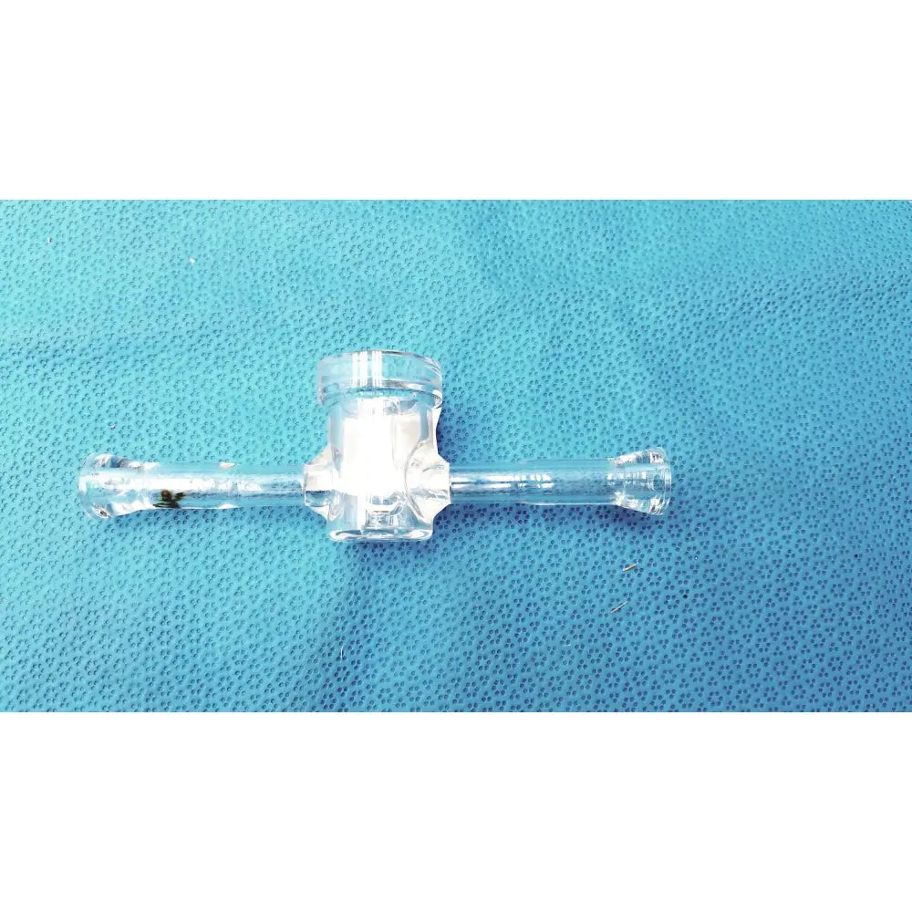 Clear plastic medical tubing connector with central hub and two perpendicular arms for glass lab adapter use
