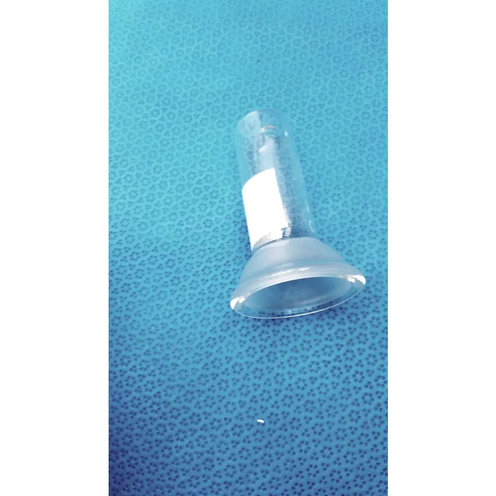Clear plastic suction cup with white label and metallic band attached to glass lower vessel 40ml for lab glassware use