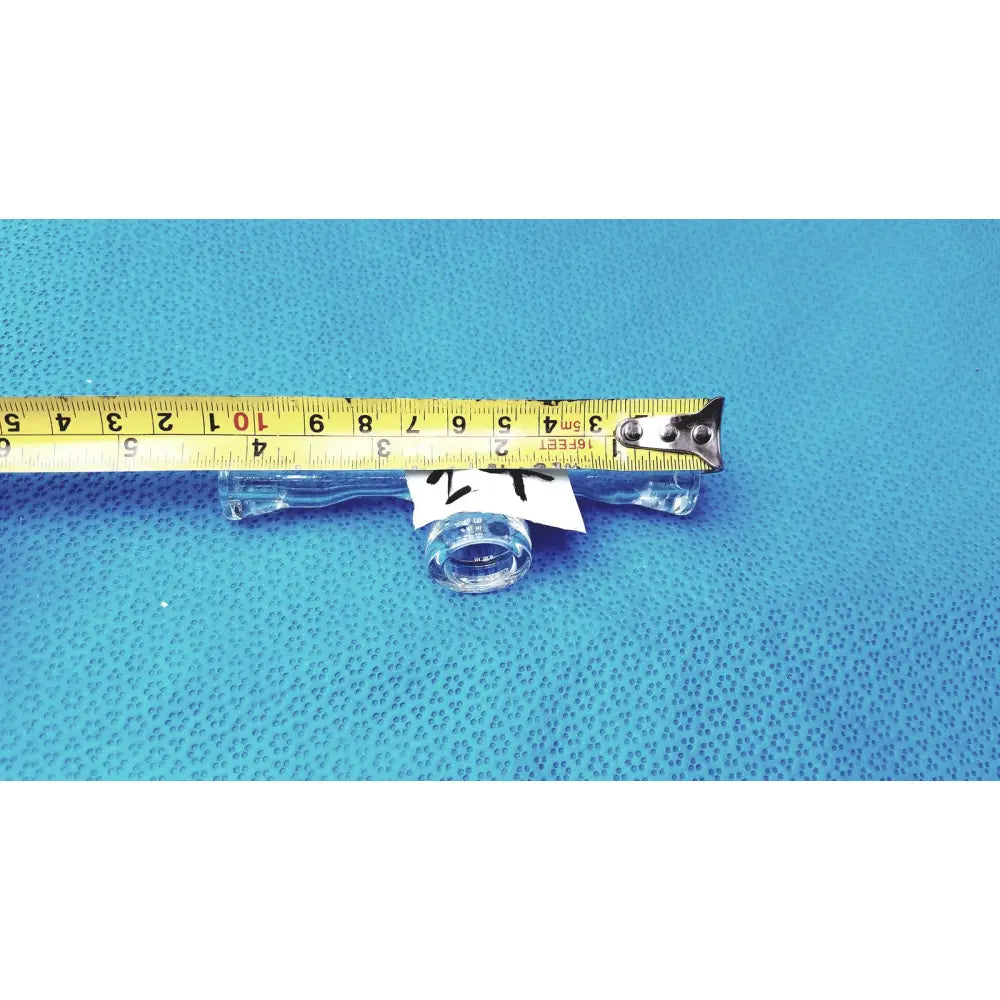 Clear glass stopcock valve adapter with white label featuring borosilicate lab control for precise flow regulation