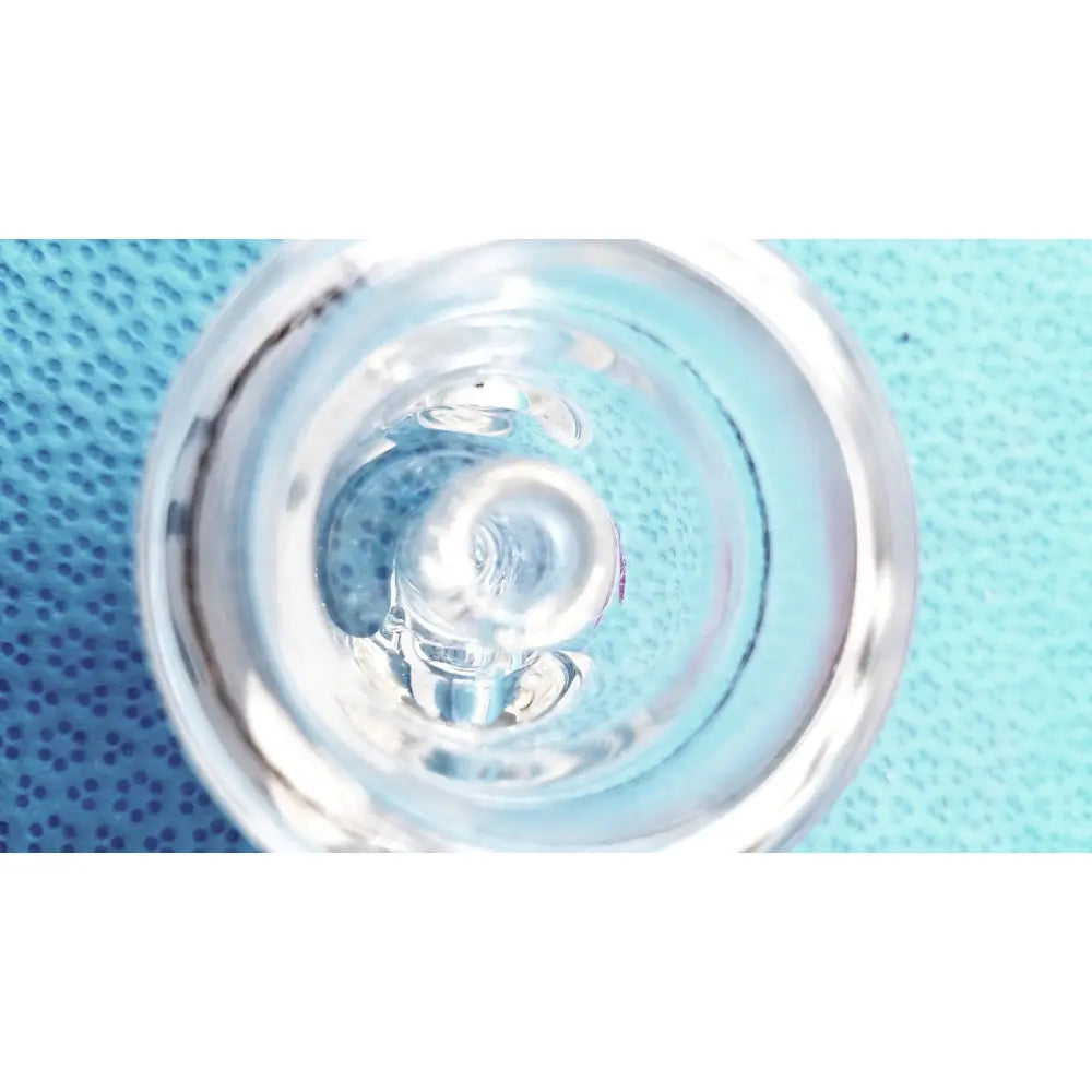 Clear glass straight bore stopcock with smooth curved interior and concentric rings for lab glassware ground glass valve