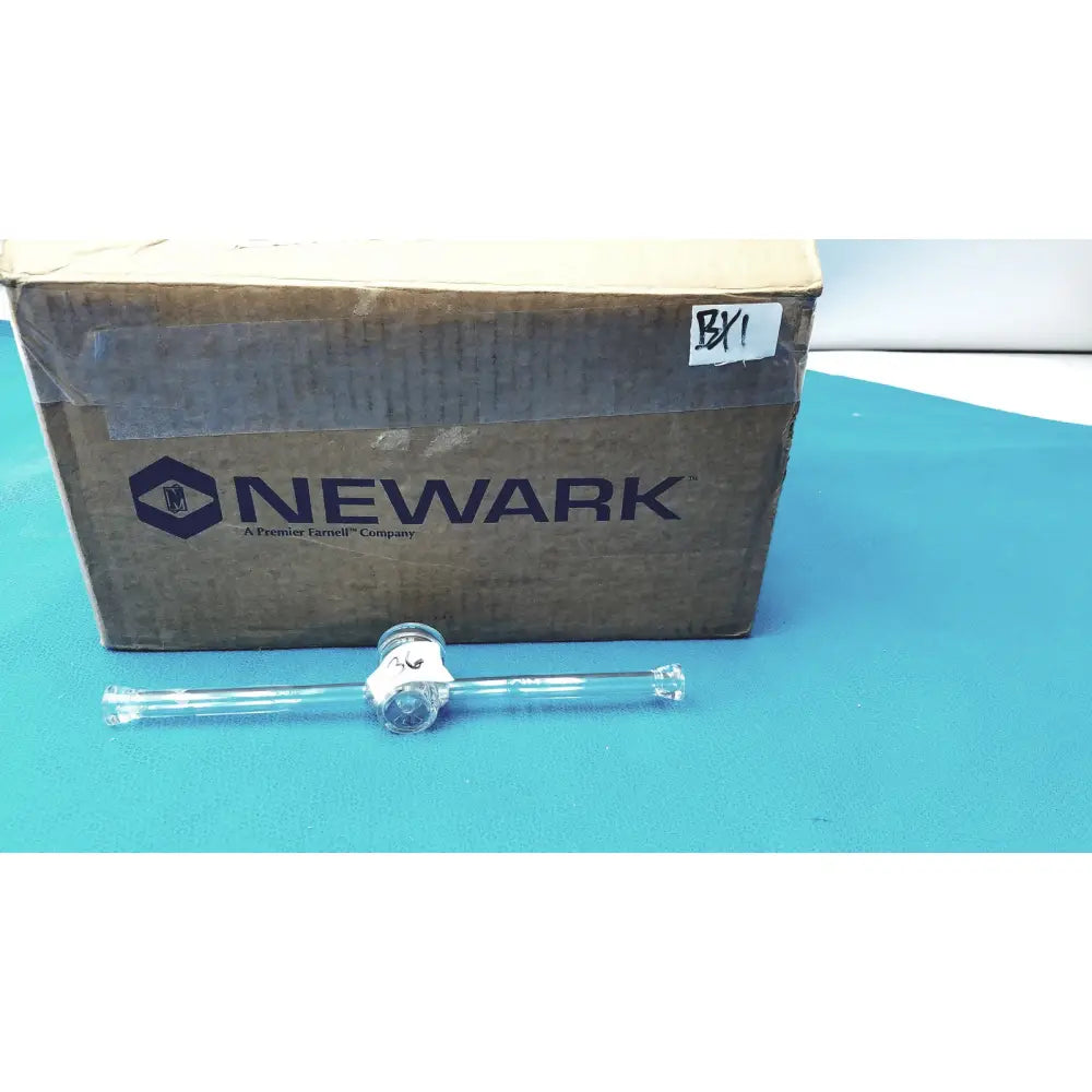 Clear glass straight bore stopcock with silver-toned metallic ground glass valve and cap for lab glassware use