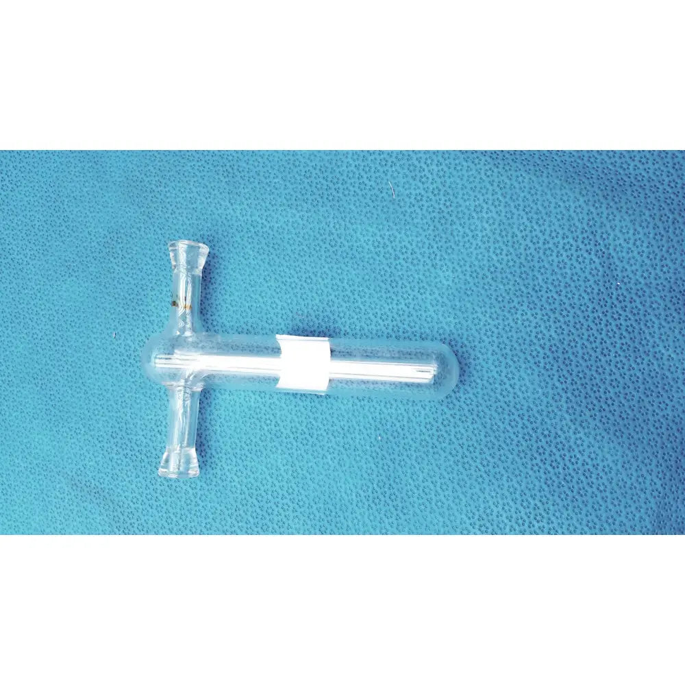 Clear glass tenbroeck tissue grinder pestle with white label wrapped around central section for lab homogenizing