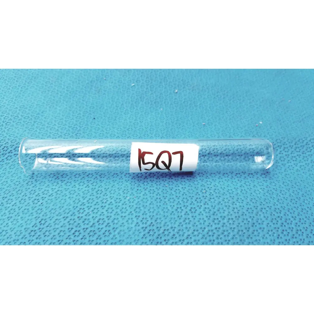 Clear borosilicate glass test tube 25x150mm with white label handwritten 15q7 in red ink open top 55ml capacity