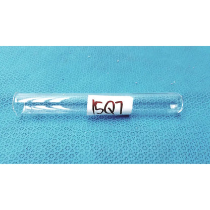 Clear borosilicate glass test tube 25x150mm with white label handwritten 15q7 in red ink open top 55ml capacity