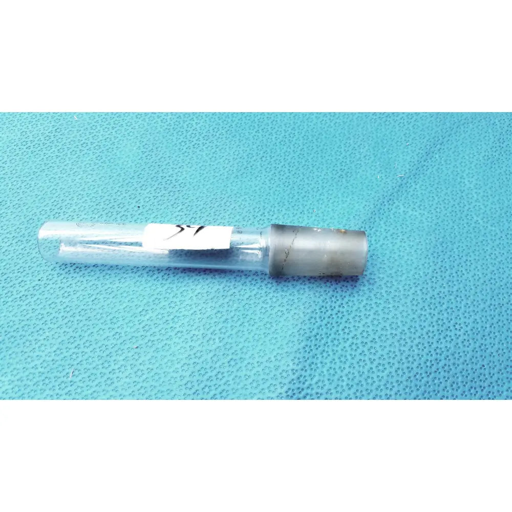 Clear glass thermometer adapter with gray metallic cap and white label with black markings for laboratory use