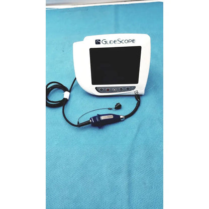 White glidescope video monitor an162878 with dark blue handheld device connected by black cables for airway management