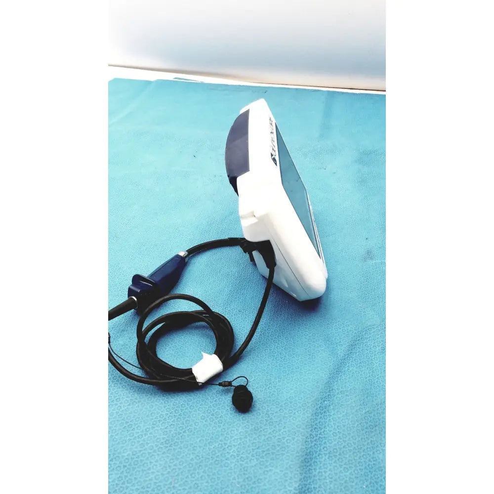 White and dark gray glidescope video monitor an162878 endoscope with coiled black cable and small microphone attached