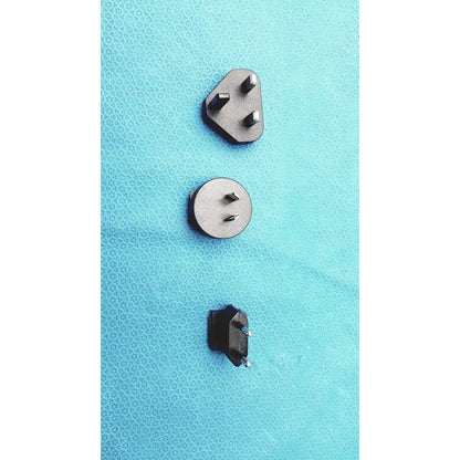 Three distinct metallic and black plastic power plugs with varying pin configurations on the glidescope video monitor an162878