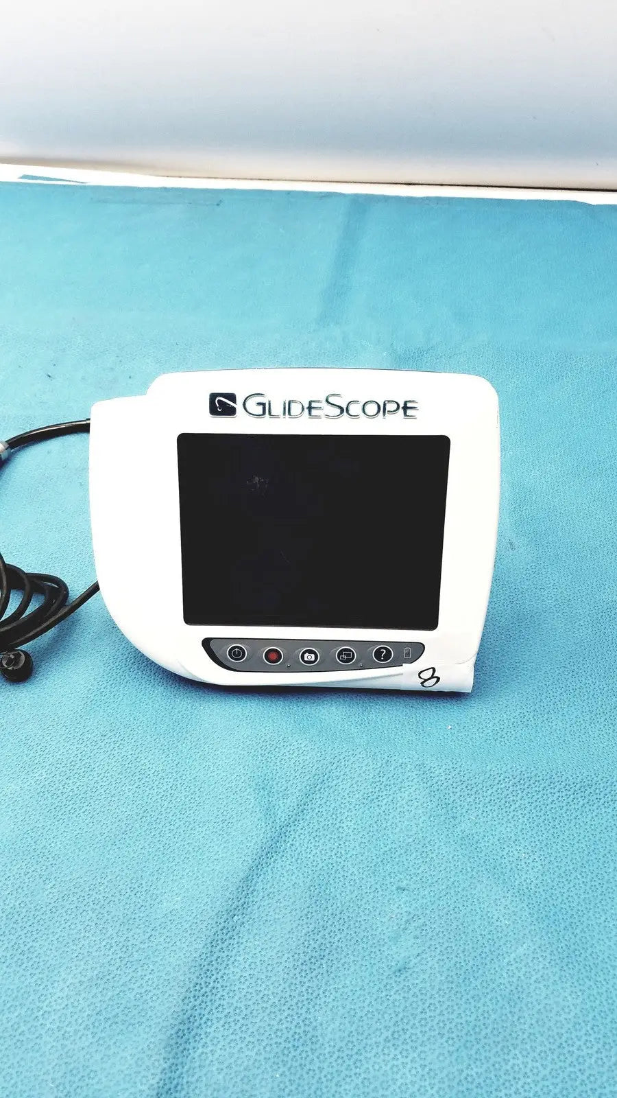 White glidescope video monitor an162878 with black screen and circular control buttons for medical video laryngoscopy