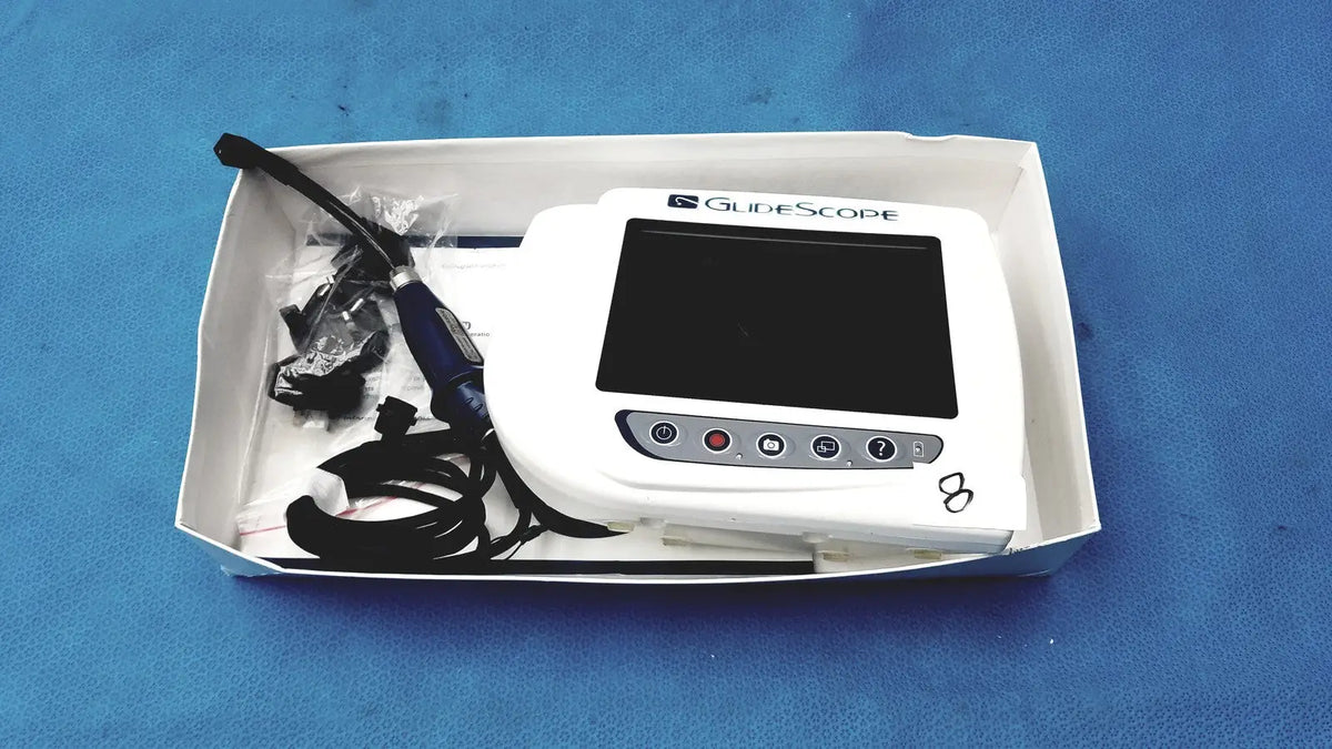 White glidescope video monitor an162878 with black screen, control buttons, blue-handled endoscope, and connecting cables