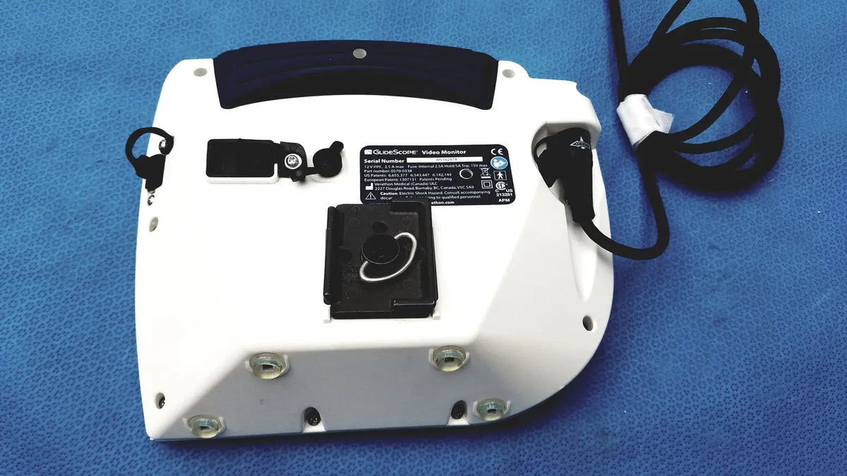 White plastic glidescope video monitor an162878 with black handle and attached power cord for medical use