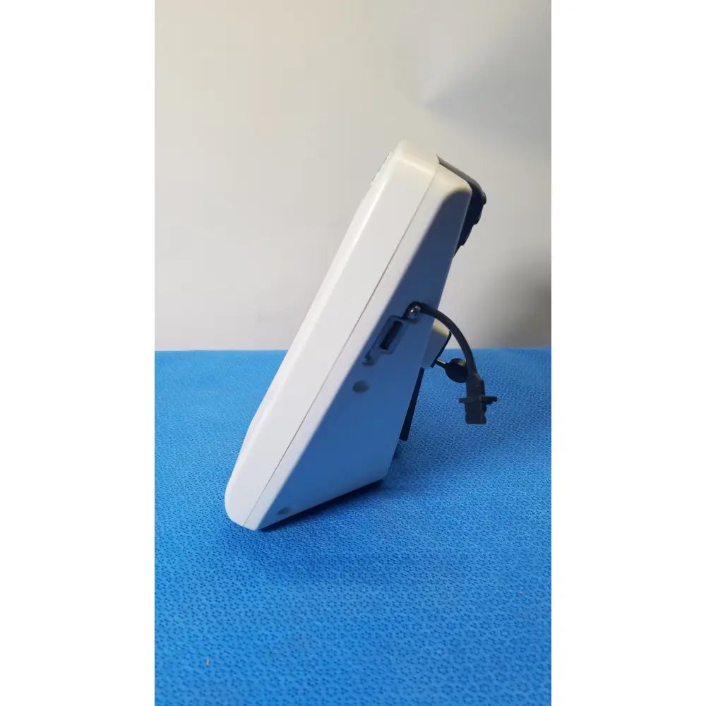 White plastic digital thermometer with black cable and connector for glidescope video monitor reuse medical applications