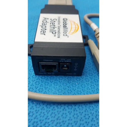 Black globalmed innovative telemedicine stethip adapter with white label orange logo ethernet and power input ports back side